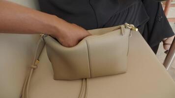 stealing smart phone from a handbag placed on a chair video