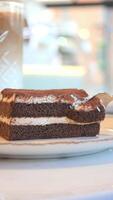 Decadent dessert slice captured in a cozy cafe setting video