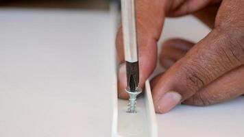 Building with precision using a screwdriver on a project video