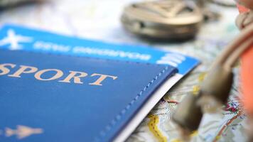 Planning travel with passport and map on table video