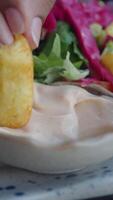 dipping fries in sauce with salad video