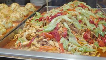 Chicken stir fry with colorful vegetables served hot video