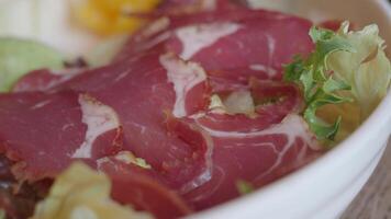 Fresh salad with cured meat and greens ready to enjoy video