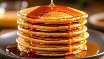 Stack of pancakes with maple syrup photo