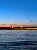 Peter and Paul Fortress in Saint Petersburg Russia. Beautiful view of the landmark during white nights. Vertical photography. photo