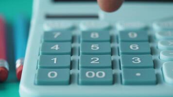 Using a calculator for math problems in a study space video