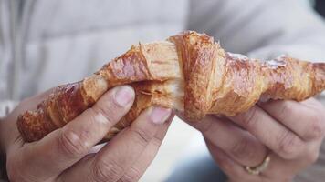 Enjoying a freshly baked croissant at a local bakery video