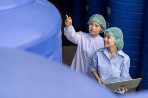 Factory of food. beverages, engineer or inspector check quality water for production line, check PH parameters of water on process. Quality control or assurance, Good standard, Healthy photo