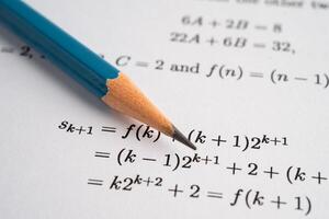Pencil on mathematic formula exercise test paper in school. photo