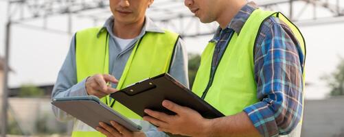 Engineers team discuss check and review the blueprint of construction. Contractor inspection drawing before start project civil. project planning, consulting. architecture. photo