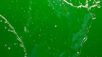 splashing water drops, water splash isolated on green screen background. perfect for compositing fresh, perfect for nature, energy, purity, refreshment, visual effects, and transparent fluid motion video