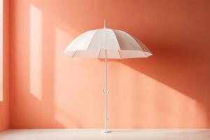 Solitary White Umbrella Against a Peach Wall Bathed in Soft Light photo