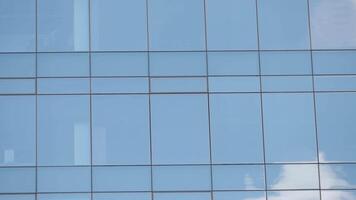 Reflections in the glass building on a clear day video