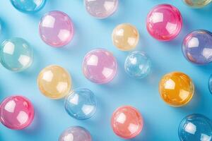Colorful water beads creating an abstract pattern on blue background photo
