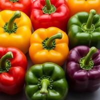 A group of colorful peppers on a white background photo