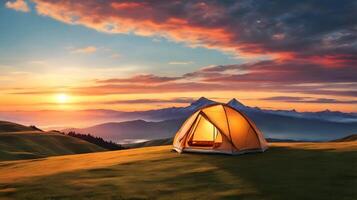 Illuminated Tent at Sunrise in Majestic Mountains photo