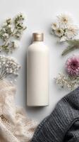 A bottle of fabric conditioner surrounded by floating fabric textures. photo