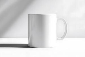 Minimalist white mug on white surface with soft window light and shadow photo