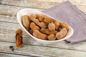 A bowl filled with peanuts and a napkin photo