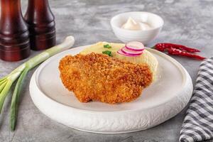 Fried chicken with mashed potatoes and green onions photo