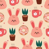 Pattern of cute bunnies and plants vector