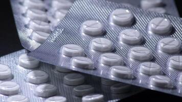 Medical tables with pills gyrating video