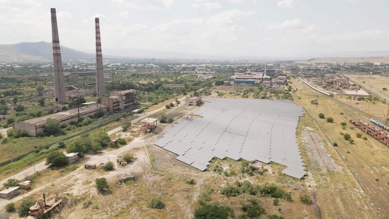 Aerial fly over view solar power - Aerial Fly Over View Solar Power Plant Or Farm Next To Abandoned Industrial Complex In Rustavi Georgia Illustrating Contrast Of Renewable Energy Progress And Decaying Polluting Heritage Video