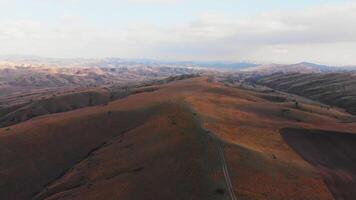 Aerial 4wd isolated riding on the dark mountain with scenic landscape background. Vashlovani national park video