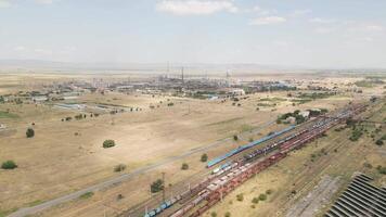 Aerial view of Rustavi industrial complex with factories, chimneys, warehouses, and storage contributing to regional GDP industrial output of Georgia economy video
