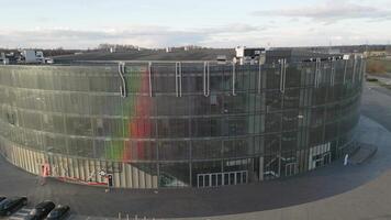Siauliai, Lithuania - 12th november, 2024. Aerial view Siauliai arena panorama with city buildings outside in sunny autumn day. Hosts basketball games, concerts and shows video