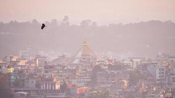 Aerial dynamic 4k timelapse boudhanath stupa in nepal capital city kathmandu with traditional architecture buildings. Boudha Stupa - UNESCO's World Heritage Site. Golden hour Boudhanath panorama video