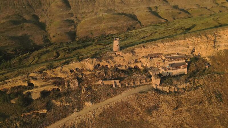 Aerial Natlismtsemeli Monastery - Aerial Natlismtsemeli Monastery Complex Carved Into Cliffs Medieval Georgian Orthodox Architecture In Remote Kakheti Hills Part Of David Gareja Monastic Complex Azerbaijan Georgia Border Zone Video