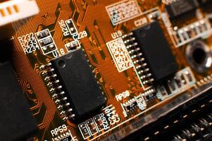Printed circuit board, close-up. Small microprocessor, microcontroller on the motherboard of a modern desktop PC, macro of an object, close-up, shallow depth of field, nobody photo