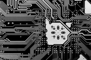 Close-up of a printed computer circuit board. Computer motherboard, macro shot. Abstract futuristic background photo