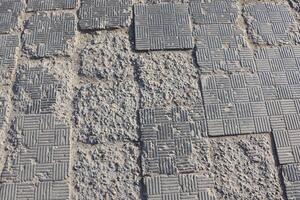 Detailed overview of Textured Pavement that exhibits various Wear and Tear Patterns photo