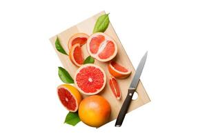 fresh Fruit grapefruit slices isolated on white background. Top view. Copy Space. creative summer concept. Half of citrus in minimal flat lay photo
