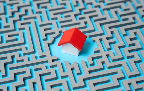 A house in the middle of a labyrinth mazes. Difficulty in buying your own home. Infrastructure and transport system, laying a route. Obstacles to homeownership, bureaucratic complexity photo