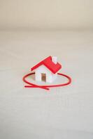 The house is circled with a red line. Select and inspect a house before purchasing. Inspection, legal verification, and securing a quality investment before purchase. photo
