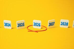The year 2026 is circled in red in a number of others. Future planning. Financial forecasts, election years, economic cycles, or goal setting. photo