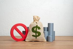 The dollar is a money bag and a sign of prohibition. Freezing of assets. Sanctions and embargoes. Confiscation of funds. Frozen reserves, banking restrictions, or legal confiscation. photo