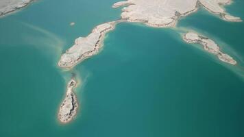 Aerial view of layered peninsulas and lone islet at Kuimazar Reservoir video