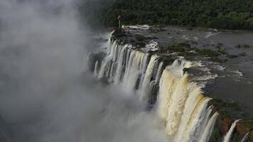 Aerial view of Iguazu Falls showing powerful waterfalls in slow motion video
