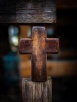 Rusty Metal Cross on Wooden Posts A Close Up Image of Faith and Rustic Texture. photo