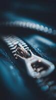 Close Up of a Metal Zipper on Dark Fabric. A Detailed Macro Photograph of a Zipper's Mechanism. photo