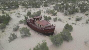 Lonely rusting vessel rests on Aralkum Desert's sandy floor video
