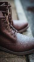 Close up of Brown Leather Boots Covered in Water Droplets. A detailed image showcasing the texture and water resistance of stylish footwear. photo