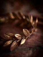 Close up of a Bronze Laurel Wreath Resting on a Brown Fabric. A Detailed Image of Ancient Roman Symbolism. photo