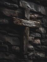 Weathered Wooden Cross on a Dark Stone Wall A Study in Texture and Contrast. photo