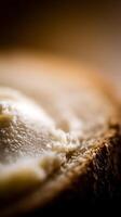 Close up of Creamy Butter Spread on Crusty Bread. A Detailed Macro Photograph of a Buttery Breakfast. photo