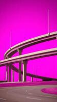 Abstract Highway Overpass Against Vibrant Pink Sky Modern Infrastructure Design. photo